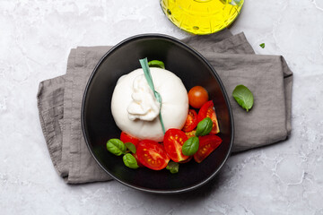 Burrata cheese, various tomatoes and olives