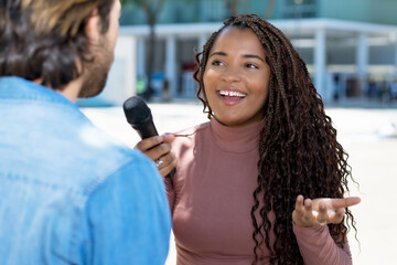 Interview of black female journalist for radio station or television