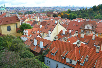 Fototapeta na wymiar Red roofs of old Prague. Panoramic view. Autumn season in Vyšehrad, Czech Republic