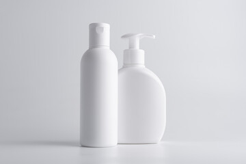 White cosmetic shampoo and lotion bottle mock-up