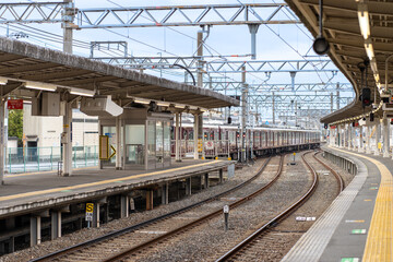 Fototapeta na wymiar Train arriving at a Japanese Train Station