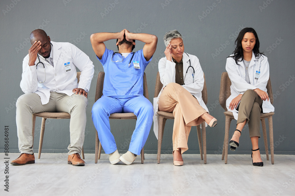 Poster Exhausted, tired and doctors waiting in the hospital with frustration, sad and burnout. Upset, professional and team of healthcare workers sitting in a line in a hallway for meeting in medical clinic