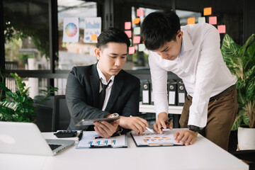 Portrait of success business people working together in home office. Couple teamwork startup concept.