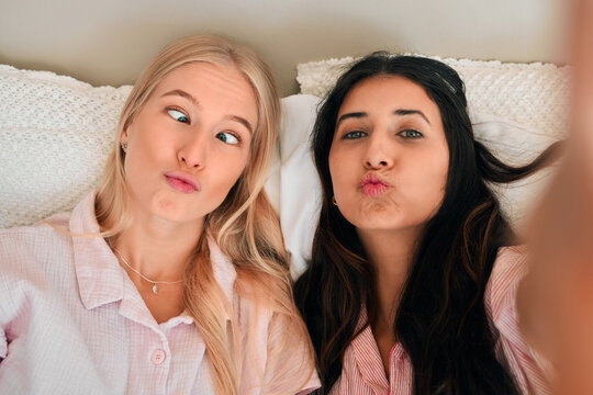 Funny, Playful And Portrait Of Women With A Selfie For A Memory, Friendship Or Comic Together. Goofy, Silly And Friends Taking A Photo In The Bedroom During A Sleepover Being Crazy And Joyful