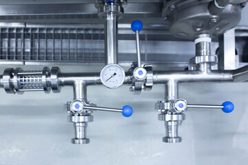 a pressure gauge on the plumbing pipeline, factory warehouse interior