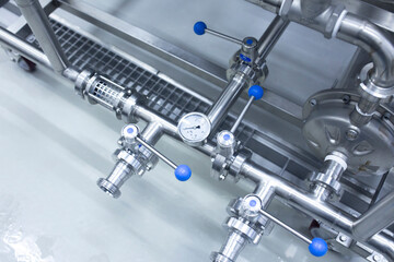 a pressure gauge on the plumbing pipeline, factory warehouse interior