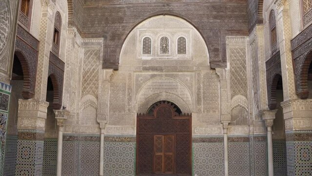 Interior footage of Al Attarine Madrasa with Arabic style patterns on the walls and pillars