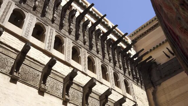 Low angle footage of ancient pieces of architecture at Bou Inania Madrasa, Fes