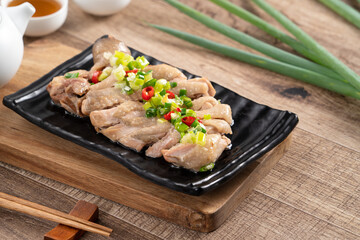 Delicious sliced chicken with scallion oil sauce, close up.