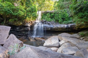 Naklejka premium Foamy Huang Nam Keaw Waterfall in Koh Kood, Thailand surrounded by the green trees