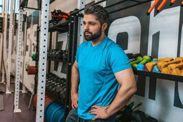 Man in blue tshirt having rest after a workout