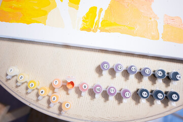 Painting by numbers with gouache at home.