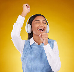 Headphones, energy and female singing in studio while listening to music, playlist or album. Happy,...
