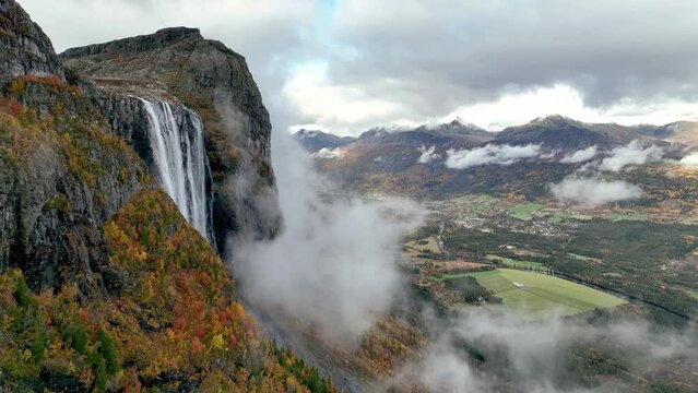 Aerial view of natural scenery of Hydnefossen waterfall falling from rocky cliffs in Hemsedal Norway