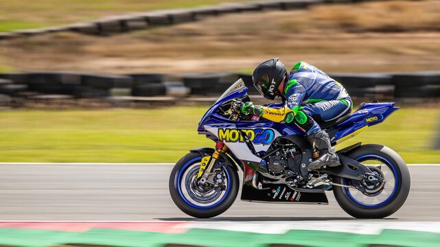 Long-exposure shot of a racing motorcycle at Queensland raceway