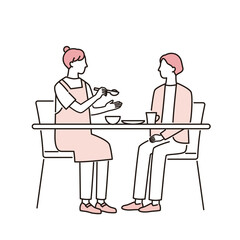 食事をする女性と介助する介護福祉士