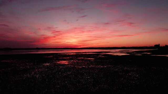 Drone shot of the breathtaking purple sky at sunset over lake Tohopekaliga in Kissimmee, Florida