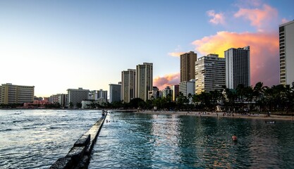 Scenic shot of skyscrapers and residential buildings in a city on the coast of the ocean