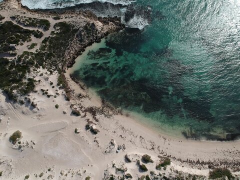 Scenic aerial shot of the Jurien Bay in Western Australia with waves washing the sandy beach