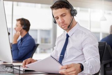 Call center, business man and corporate paperwork of a telemarketing employee with a document. Reading, online consultation and web support worker with consulting script and conversation point list