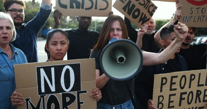 Crowd of multiracial people protest against inflation and financial crisis - Protesters marching for rise cost of living in the city