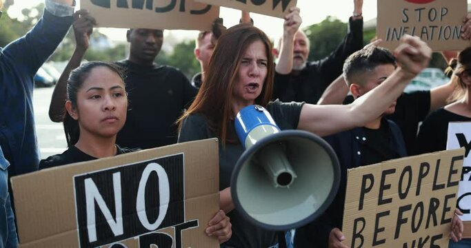 Group of multiracial people protest against inflation and financial crisis - Protesters marching for rise cost of living in the city