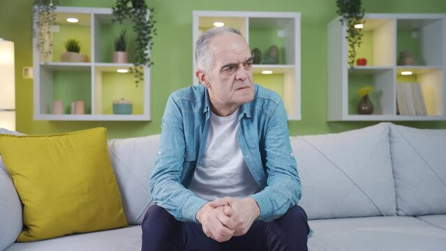 Forgetful old man. He's trying to remember.
The man who is forgetful due to old age cannot remember.
