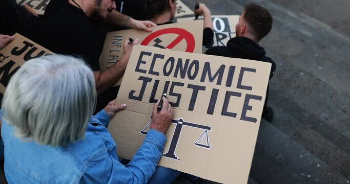 Crowd of multiracial people prepare banners against inflation and financial crisis - Protesters marching for rise cost of living