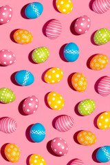 Fototapeta na wymiar color painted easter eggs on pink background