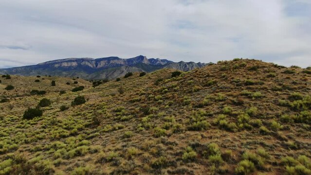 Hiking trail mountain reveal shot of  toward Sandia Mountains Albuquerque New Mexico