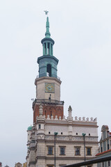 Fototapeta na wymiar City Hall with a clock on the old market square in Poznan, Poland in January