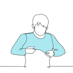 man putting on a sweatshirt - one line drawing vector. concept of putting on clothes, trying on and buying clothes