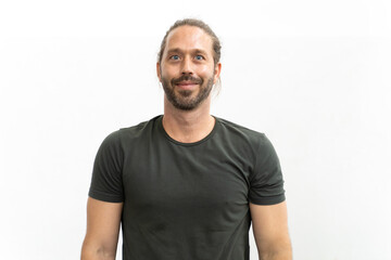 Obraz premium Portrait caucasian hipster man with long hair looking at camera standing on isolated white wall background