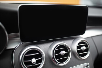 Modern car interior with dashboard and large monitor screen with free space