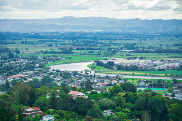 Stunning aerial view over town of Whakatane. The heart of the Eastern Bay of Plenty, New Zealand, it's nested between Whakatane River and bush-clad cliffs. Kohi Point Lookout, Whakatane, New Zealand
