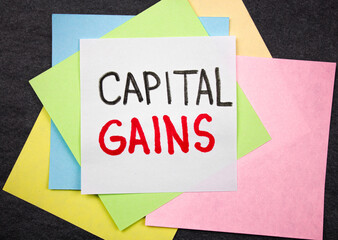 Capital gains text among colored sheets.