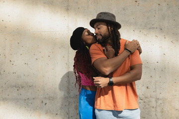 Portrait of African-American couple embracing each other.