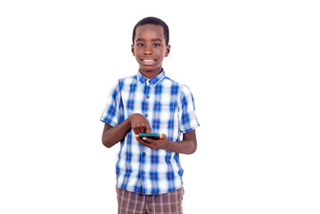 portrait of a young boy handling cell phone, smiling.