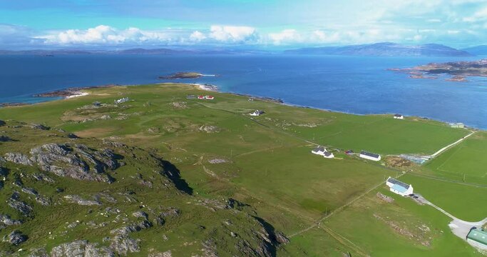 An Aerial westerly track above Iona looking north, revealing farms and houses