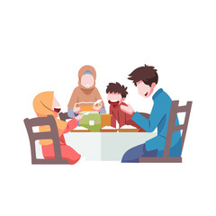 A family having a meal together during eid al fitr