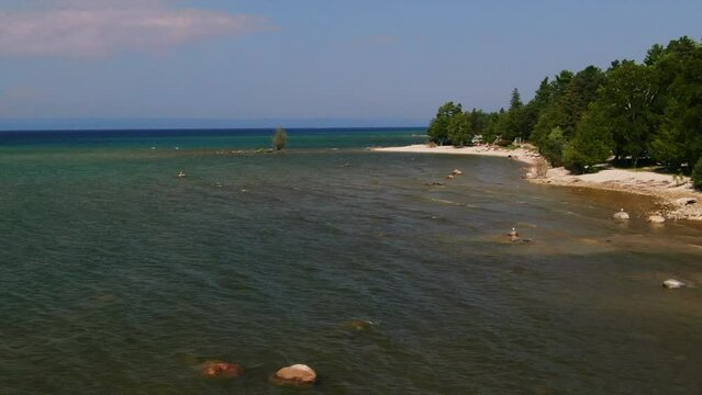 Shore and tree Lake Michigan Up North beautiful aqua water summer day windy