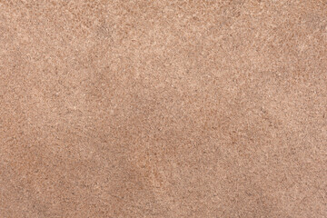 Fototapeta premium Light brown leather surface. Visible structure of the material.