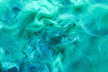 Green blue contrast liquid art background. Paint ink explosion, abstract clouds of smoke mock-up, watercolor underwater