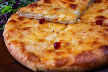 A Close-Up of Delicious Megrelian Khachapuri with a Herb and Spice Garnish