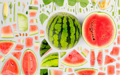Abstract background made of Watermelon fruit pieces, slices and leaves isolated on gray background.
