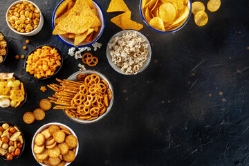 Salty snacks, party mix, shot from the top with copy space. An assortment of appetizers, a flat lay...