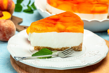 cheesecake with peache on a light background. Food recipe background. Close up