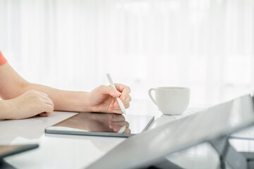 Business woman busy working with documents and tablet  in workstation.