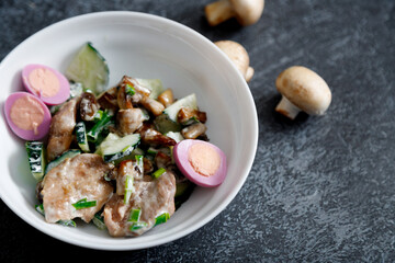 warm salad with chicken breast, mushrooms, egg and fresh arugula.