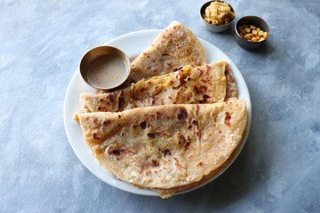 Puran Poli is an Indian sweet flatbread stuffed with chana dal, jaggery, ghee and cardamom and is...